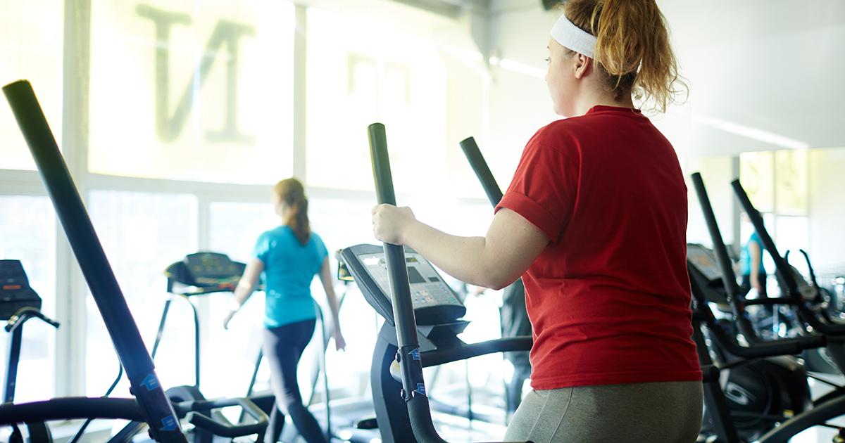 Young overweight women exercising in the gym.