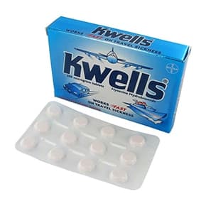 En pakke Kwells® 300mcg hyoscine hydrobromid 12 tabletter med en blisterstrimmel