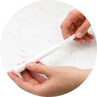 Close-up of female hands holding vaginal applicator