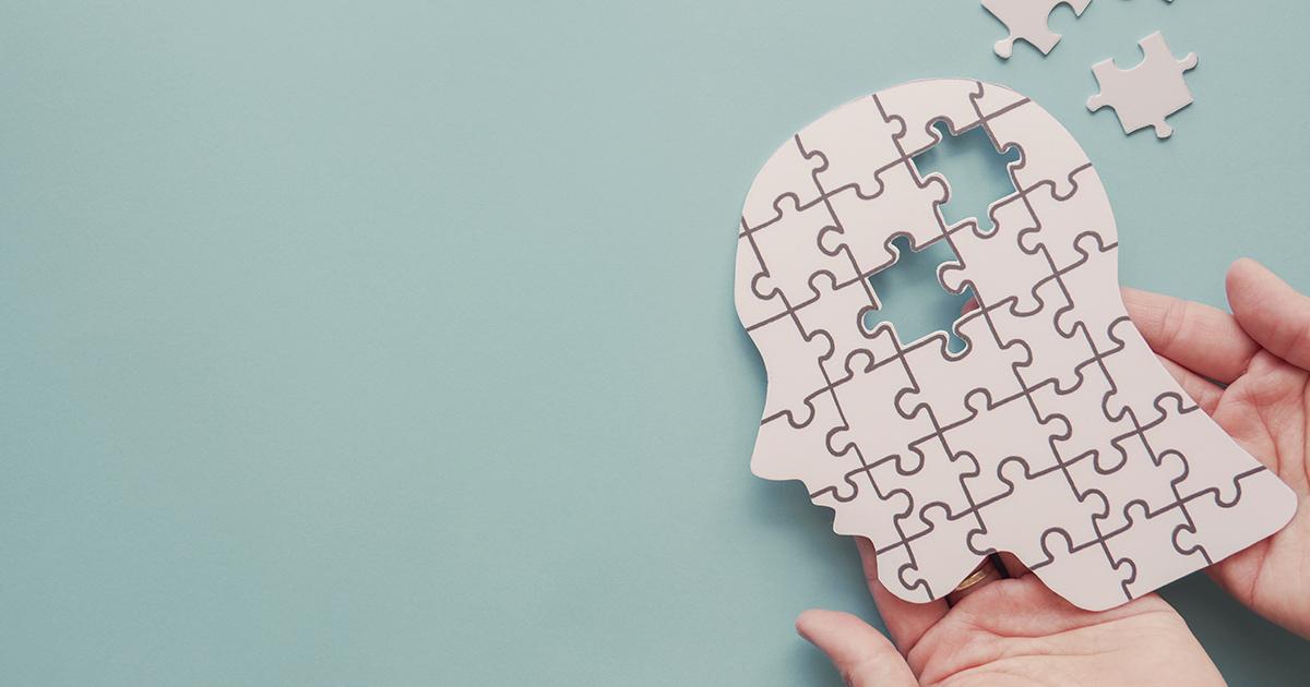 Paper jigsaw puzzle head.