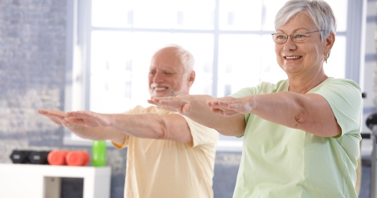 Elderly couple exercising together.