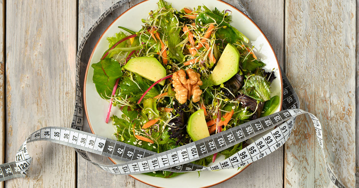 Salad with a measuring tape.