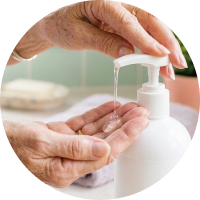 A close-up of a female hand applying a gel.