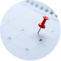 A calendar with a pin placed in a specific date