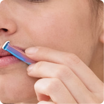 Hair removal device being used on skin