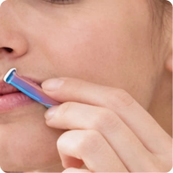 Hair removal device being used on skin