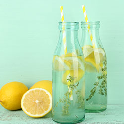 Sparkling water with a slice of lemon or orange