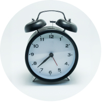 An alarm clock on a white background.