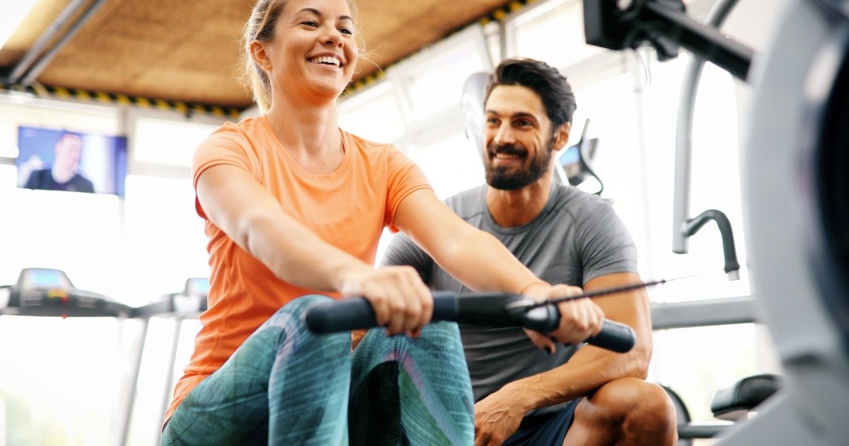 Young women exercising with a personal trainer.